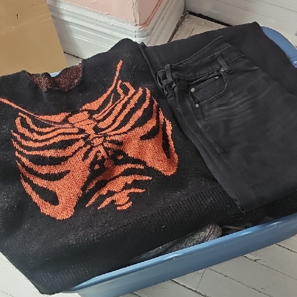 Striking Black and Orange Sweater with Textured Pattern